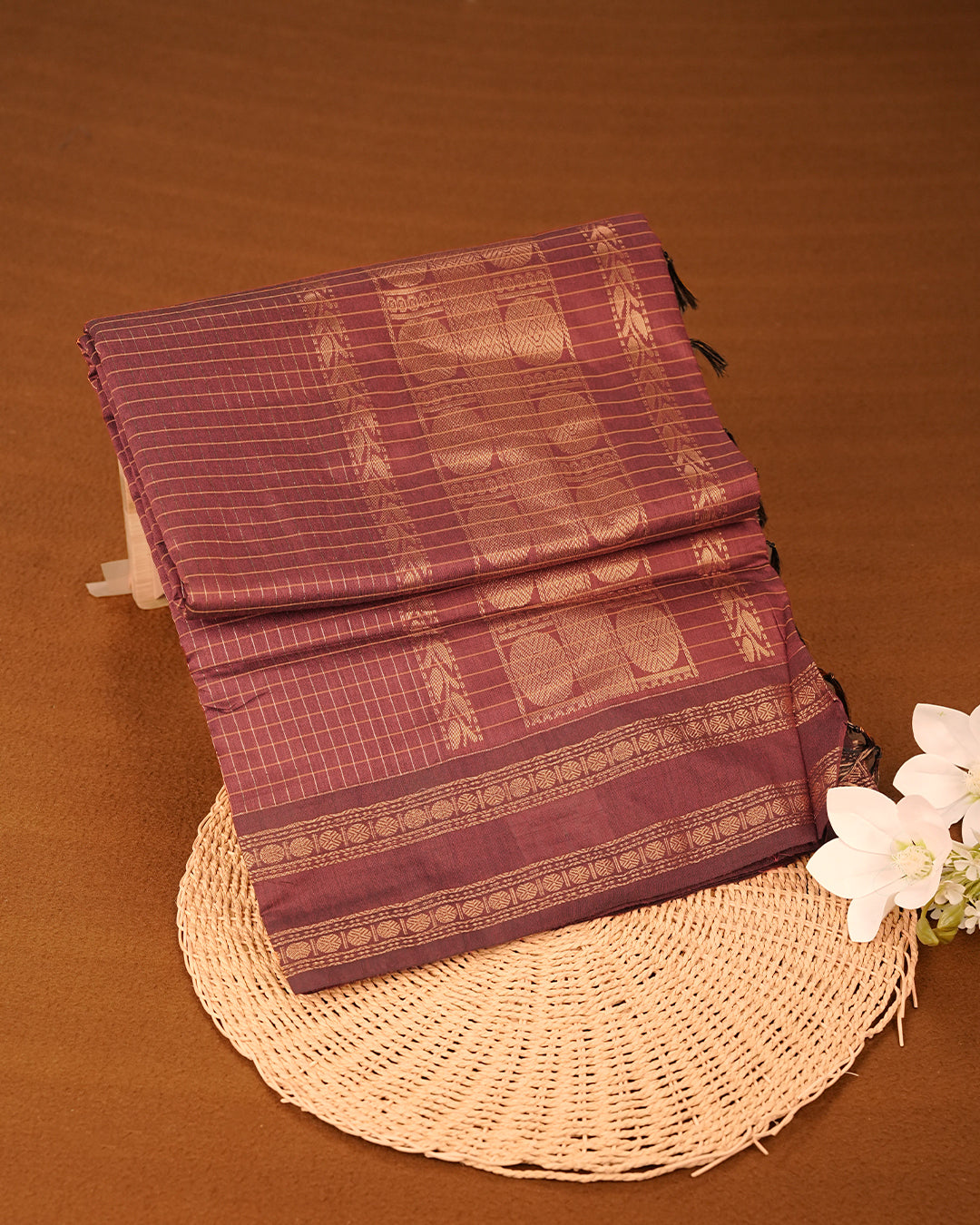 Dark Brown colour kalyani cotton saree featuring gold zari check pattern on body, complemented by Self colour with Antique zari border, paired with matching blouse piece