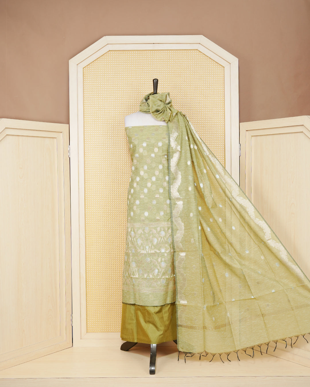 Olive colour salwar material featuring Gold and Silver Butta Design without border, paired with matching bottom and elegant dupatta.