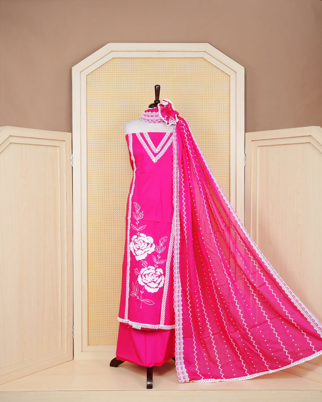Rani pink colour Cotton Salwar Material Featuring an Threadwork on Body, lace work on neck portion, Paired With a Matching Bottom and an Elegant Dupatta.