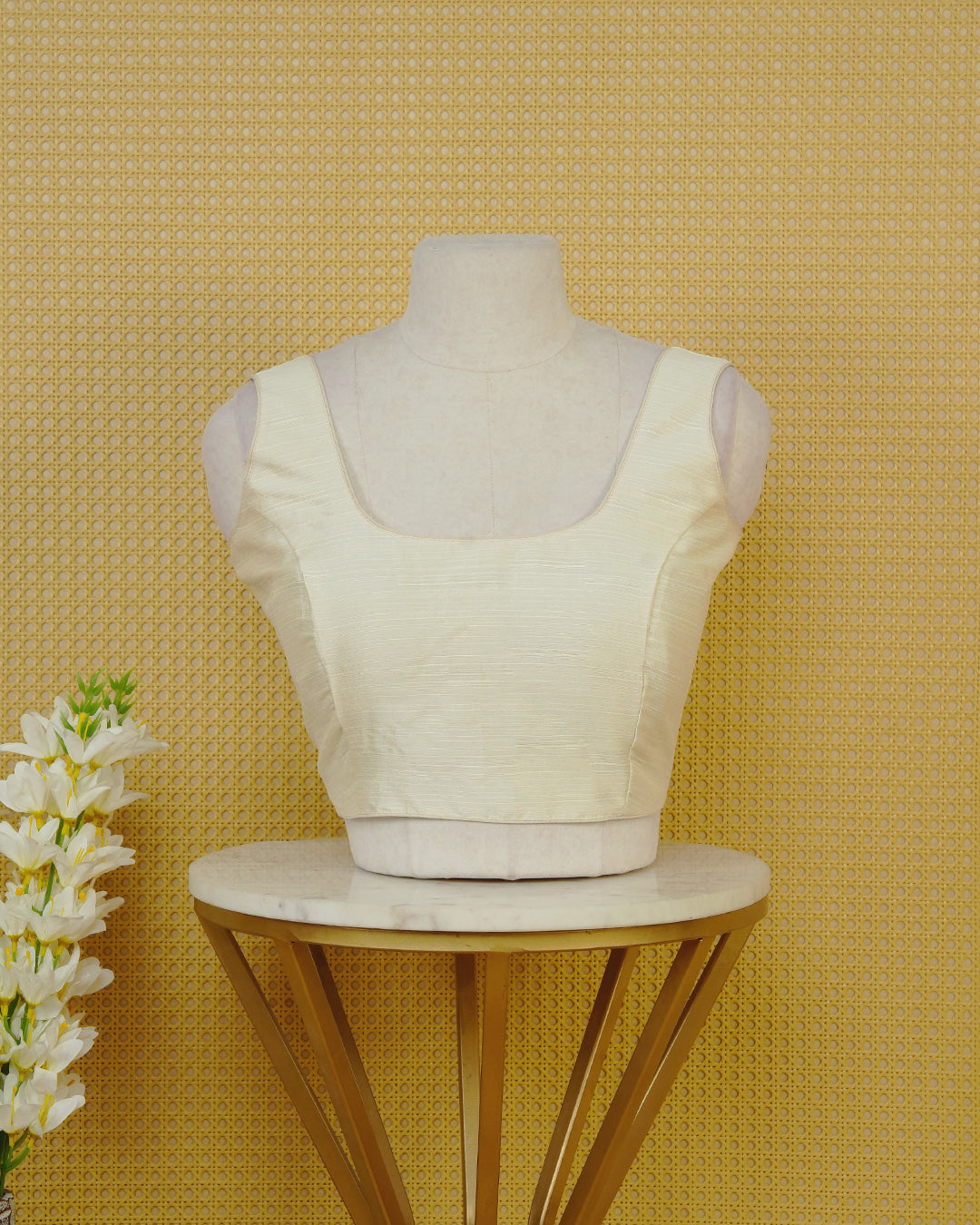 Cream Colour Plain Blouse Featuring A Classic U Neckline, Sleeveless Design, And A Simple, Clean Finish.