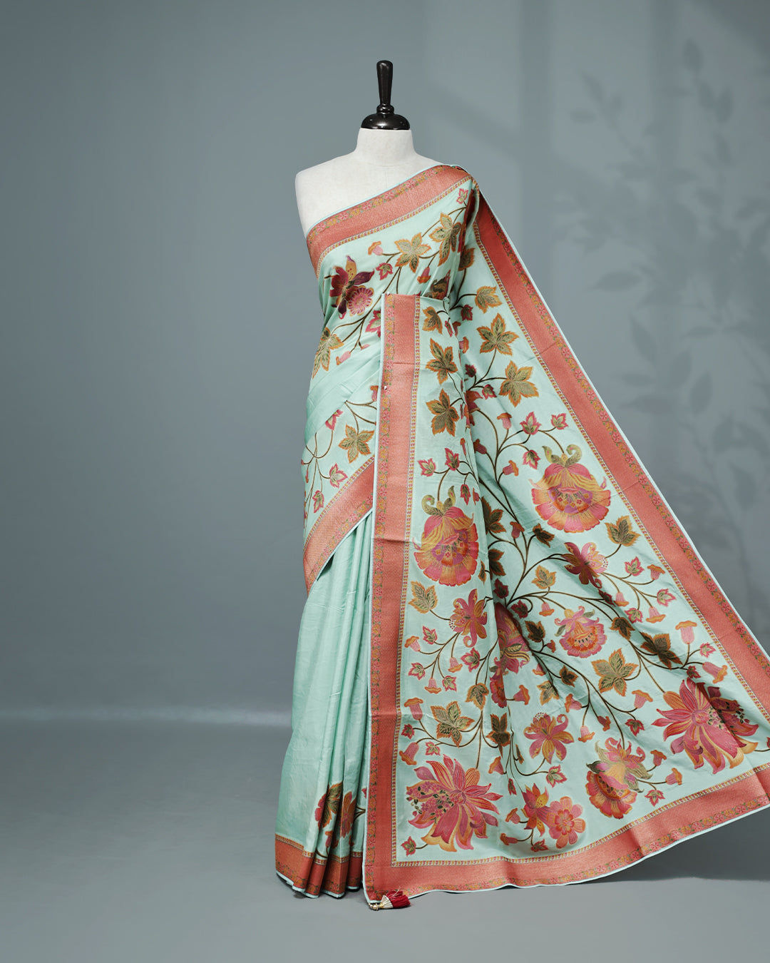 Ice Blue Colour Pashmina Saree featuring Plain body, complemented by Contrast Brick red colour with Floral pattern & gold zari on border and Pallu, comes with matching blouse piece.