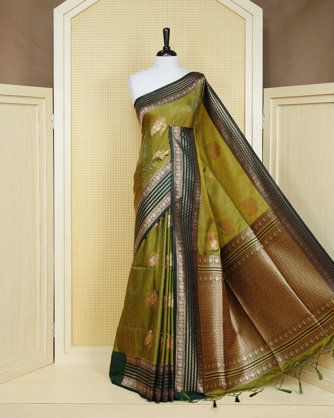 Olive & gold double shade Mulberry silk saree featuring gold floral zari patterns on body , paired with contrast forest green colour with traditional border, comes with matching blouse piece.