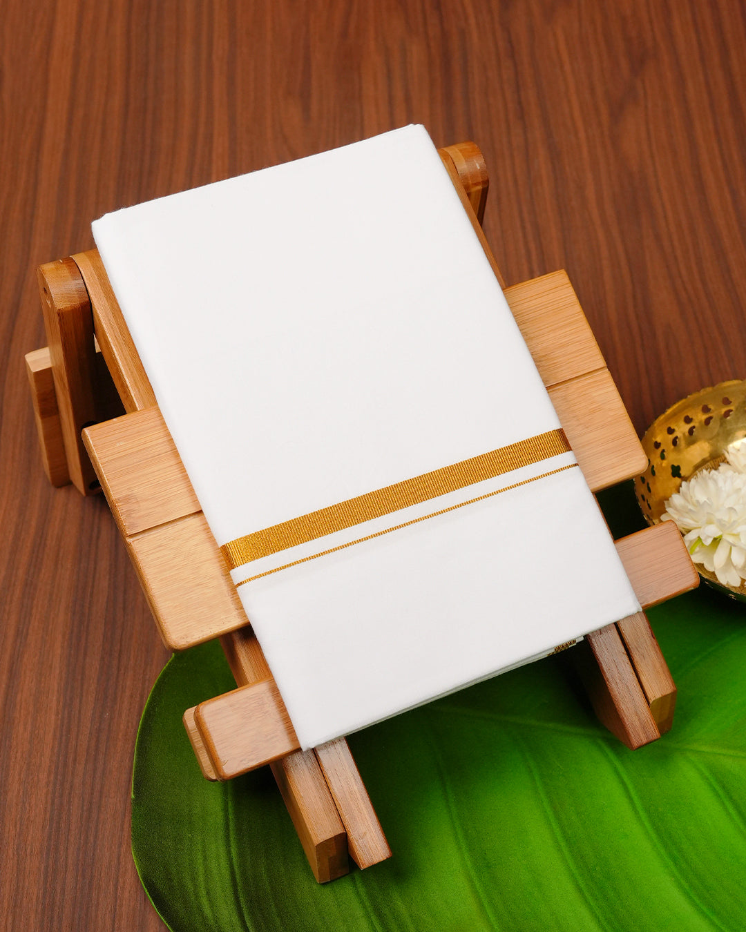 White colour cotton single dhoti featuring gold Kasav simple border.