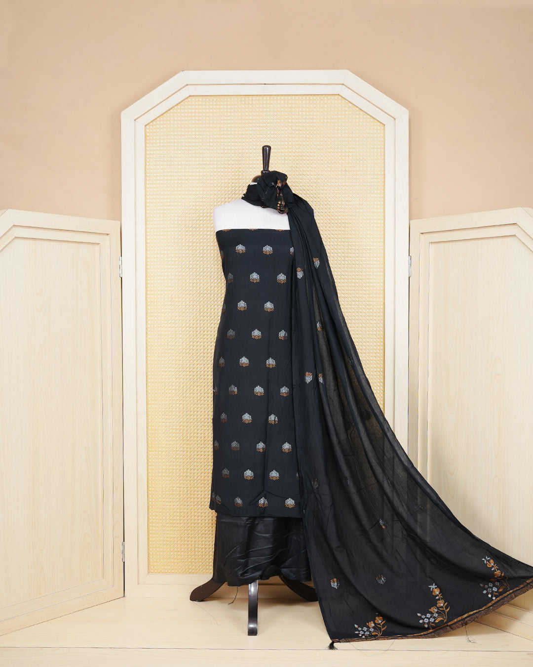 Black colour Georgette Salwar material Featuring Gold & silvar zari floral motifs on body, paired with matching bottom & Elegant Dupatta