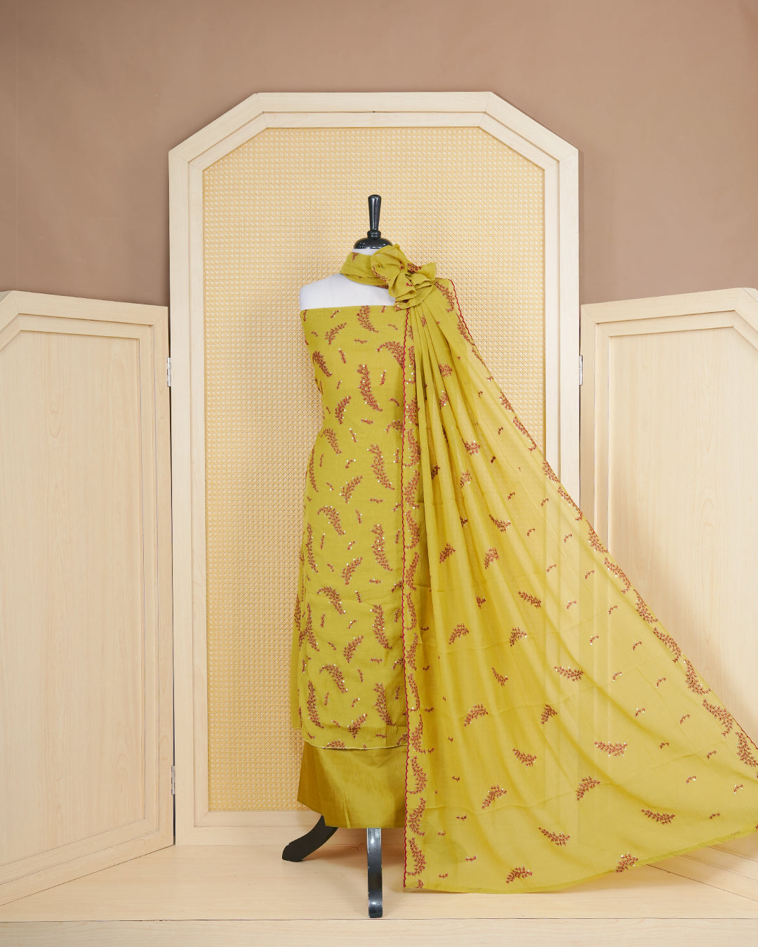 Lanzones colour Salwar material Featuring Thread and Mirorr Work on body, paired with matching bottom and Elagent dupatta.