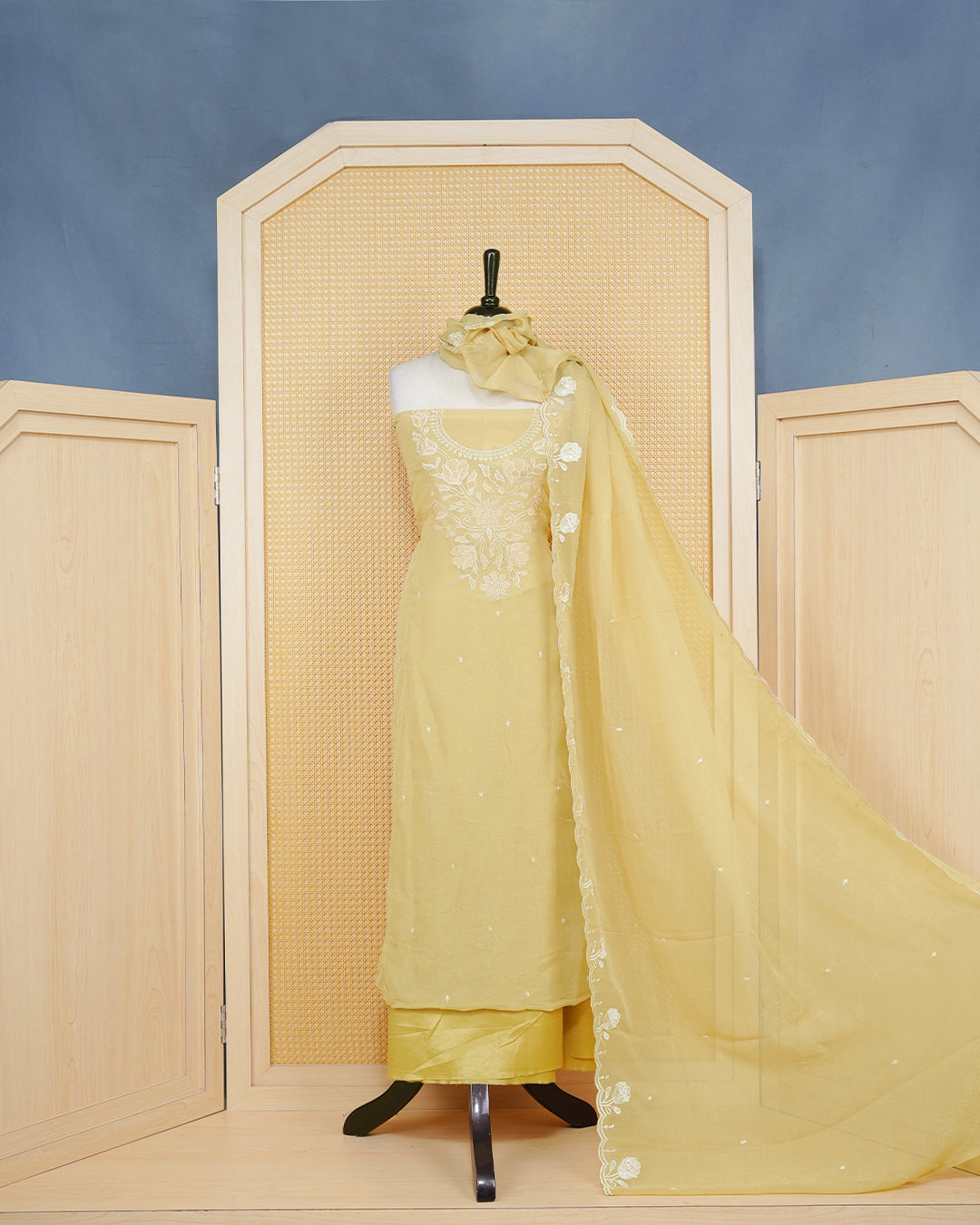 Pastal Yellow Georgette Salwar Material Features an Inrcate Floral Emproidary Pattern Aborned With Shimmering Sequin Accents, paired with matching bottom & elegant Duptta
