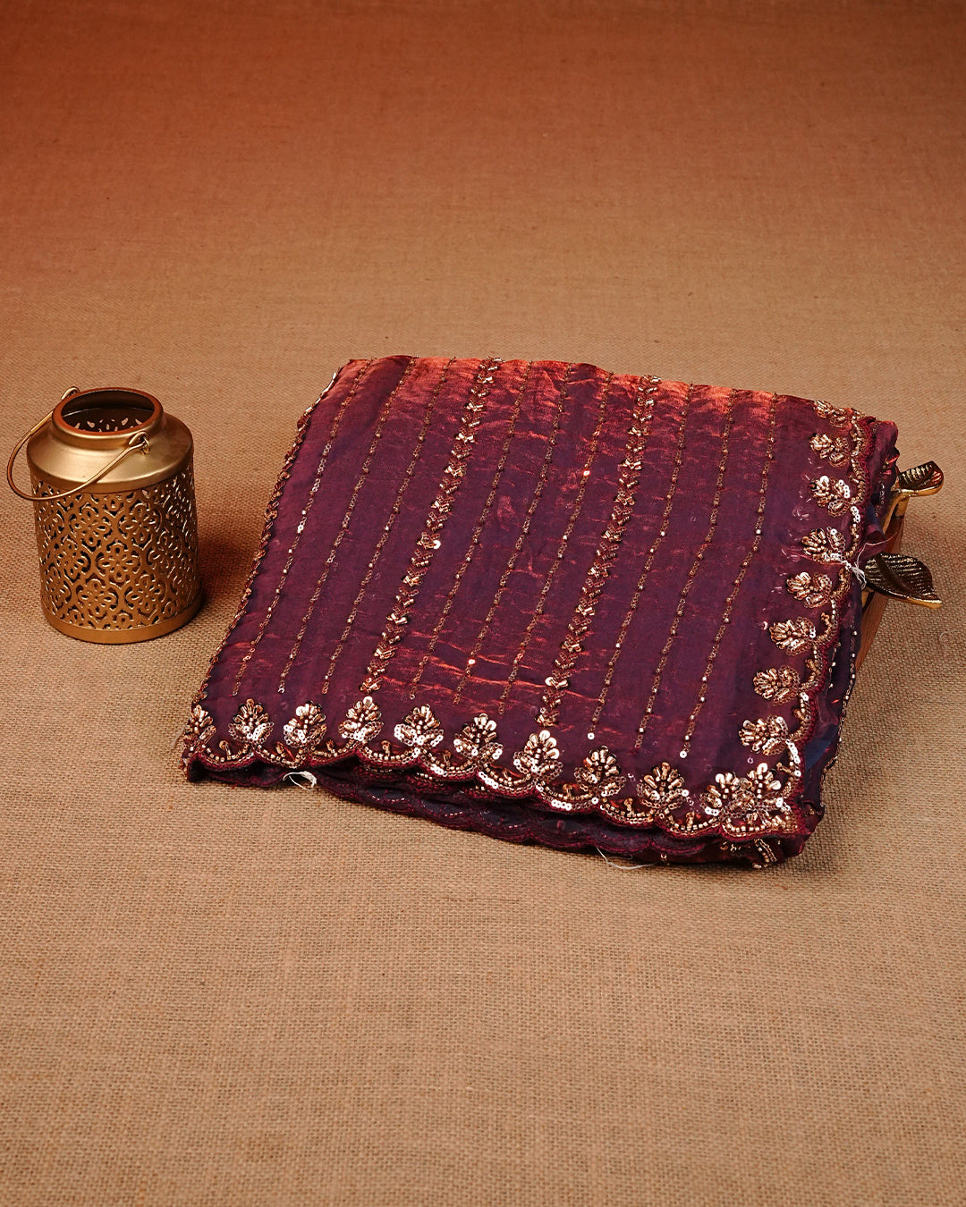 Wine colour Velvet chiffon designer saree featuring Sequins & cut beats strips on body and scallop border, comes with matching blouse piece.