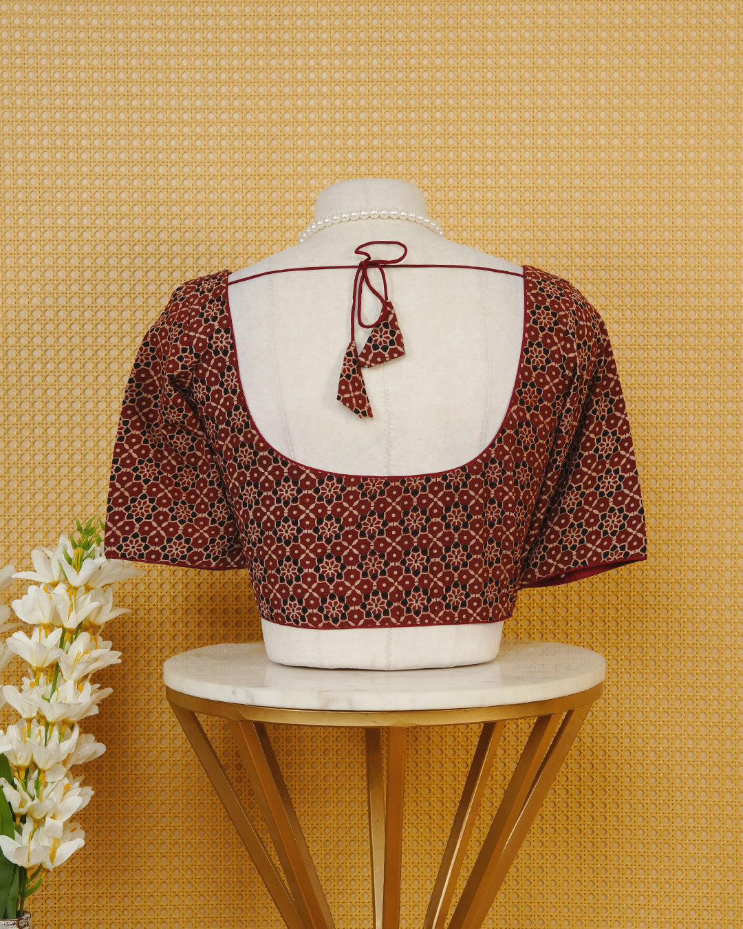 Maroon Colour Blouse Featuring A Classic U-Neck, Intricate Floral Geometric Print, And Comfortable Elbow Length Sleeves.