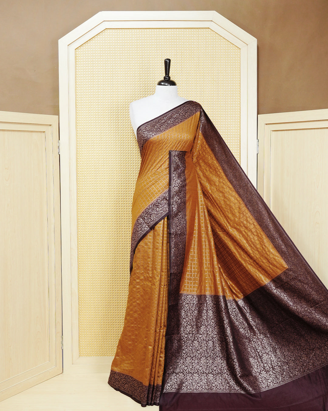 Mustard yellow Colour Semi georgette Saree having zari dotted check pattern on body, contrast dark coffee browncolour floral kodi designed Border, Rich Pallu comes with Matching Blouse piece.