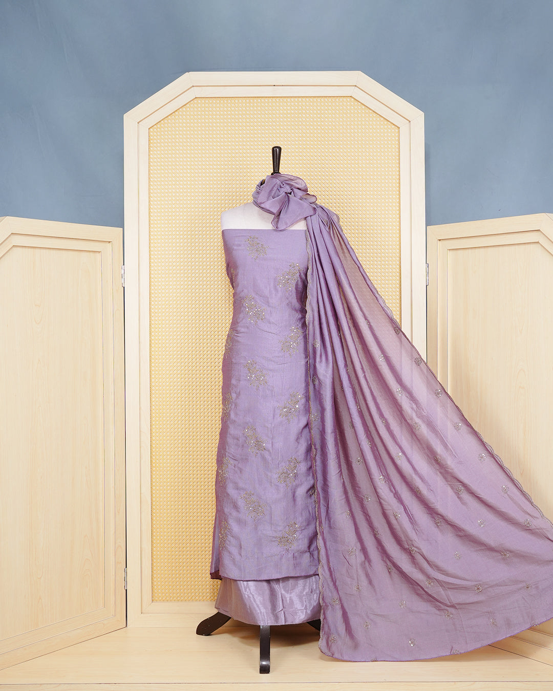 Dust Lavender Georgette Salwar Material Features an Elagent Floral Emproidary Pattern Aborned With Shimmering Metallic Gold Thread and Beadwork, paired with matching bottom & elegant Duptta