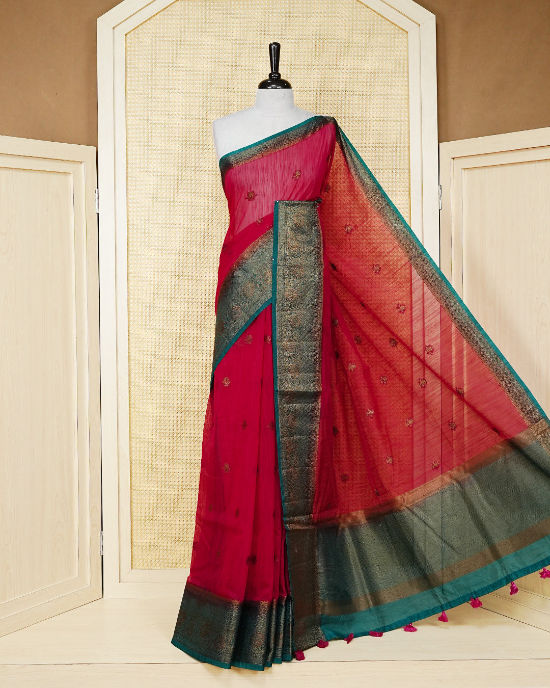 Magenta colour semi linen saree thread motifs on body, contrast teal green colour gold zari border, rich pallu comes with matching blouse piece
