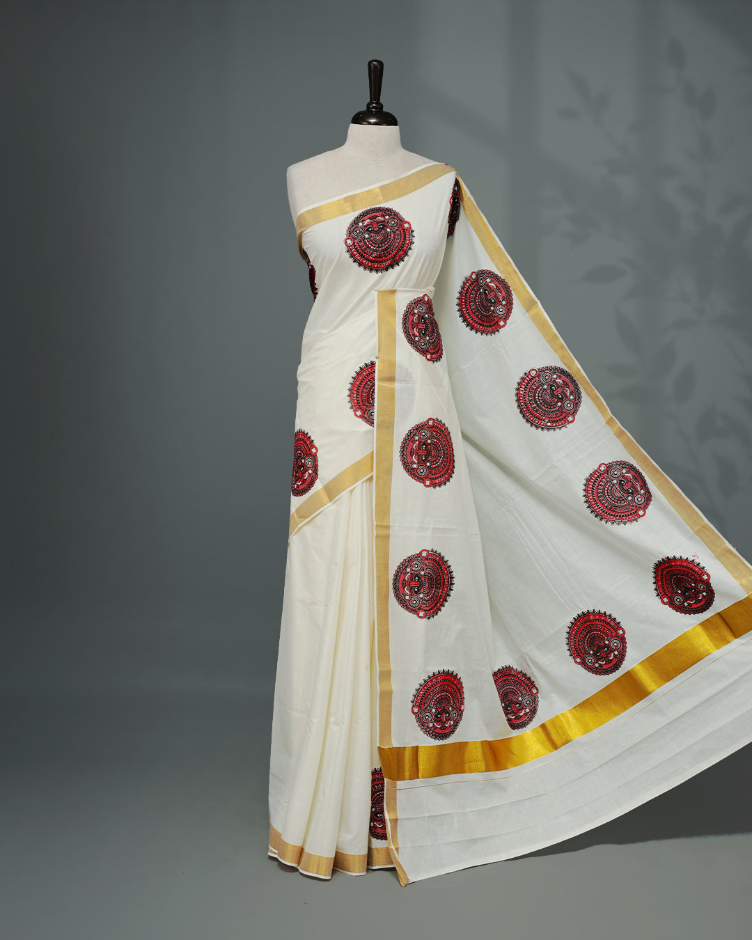 Cream colour Kerala saree Featuring an Elegant plain body, complemented by a classic gold zari with Indian art form print on border, matching blouse piece.