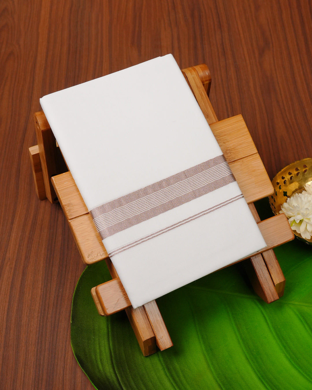 White colour cotton single dhoti featuring Rose gold Kasav border.