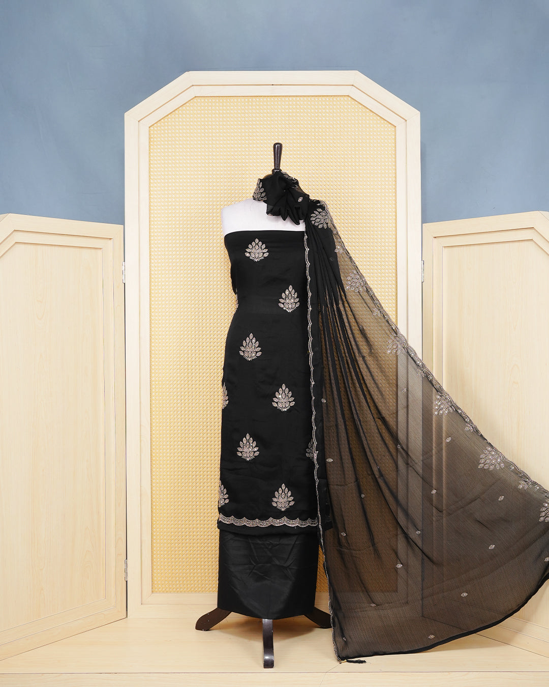 Black Georgette Salwar material Featuring Intericate Gold Emproidary Leaf Motifs and scalloped Border Work Highlighted With subtle sequin Accents, paired with a matching bottom & elegant Duptta