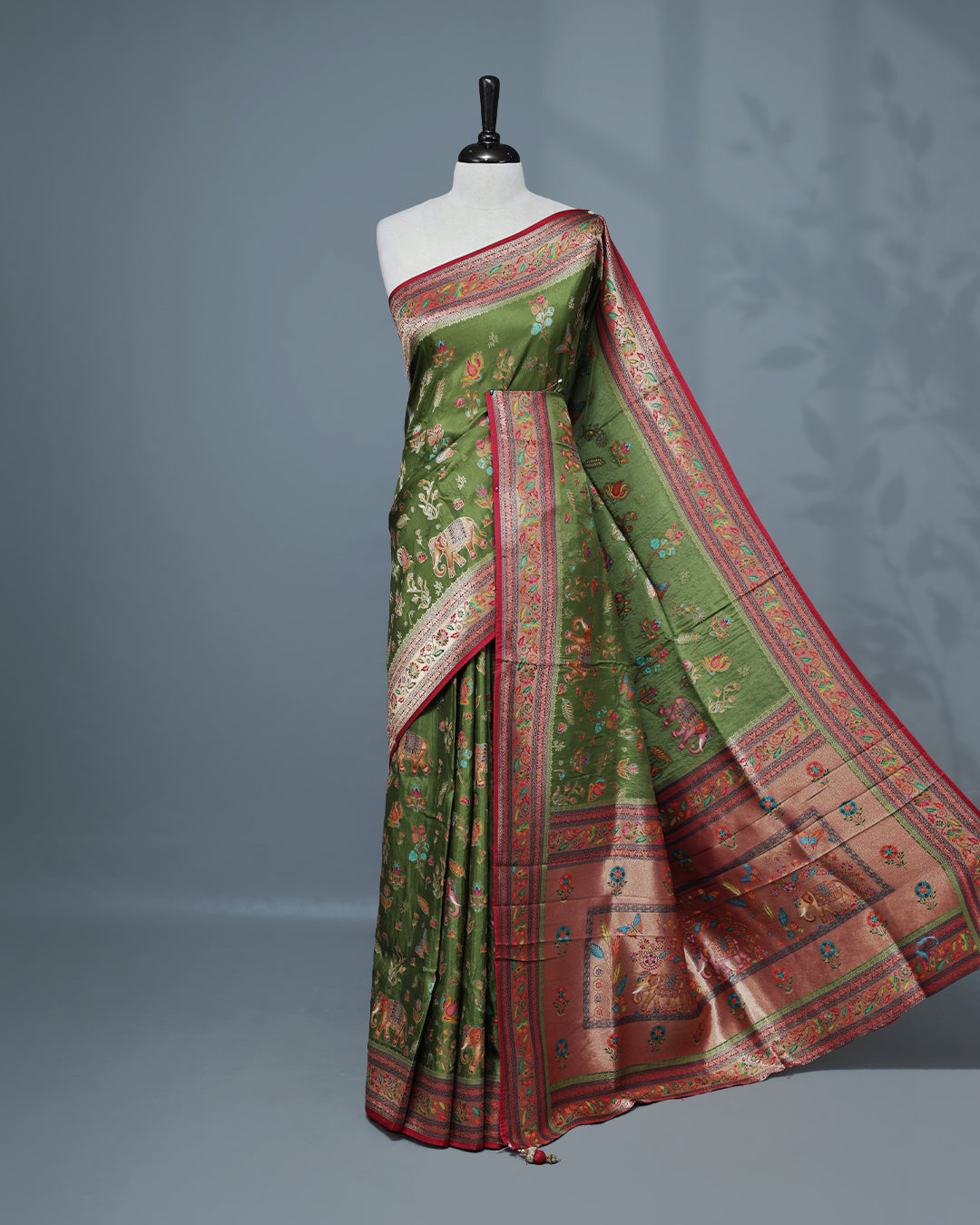 Olive Colour Pashmina Saree featuring a Patterned body, complemented by Contrast Magenta colour with Floral pattern & gold zari on border and Pallu, comes with matching blouse piece.