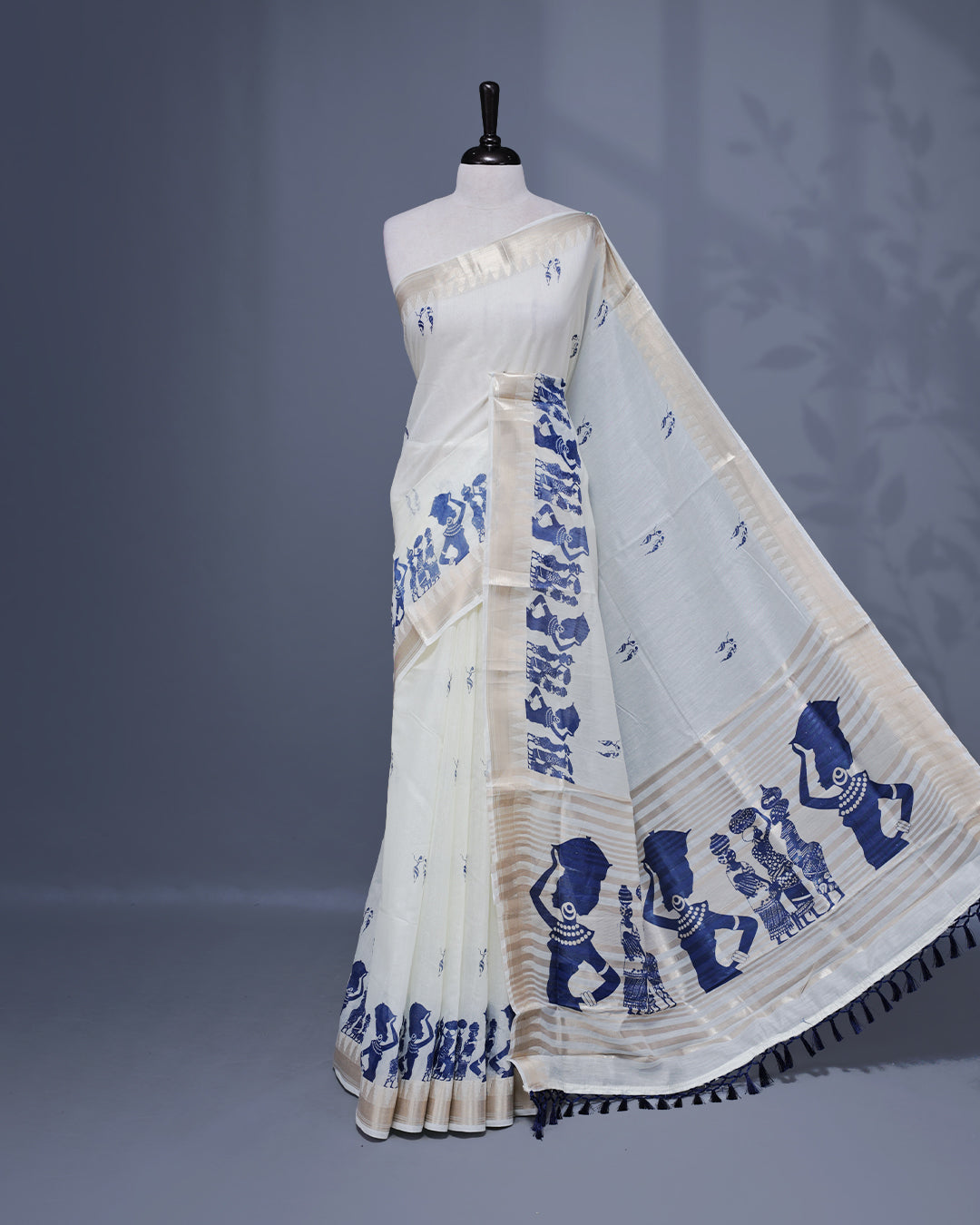 Cream colour Semi chanderi kerala saree featuring Blue colour Print on body, complemented by Light Gold zari Border, paired with matching blouse piece.