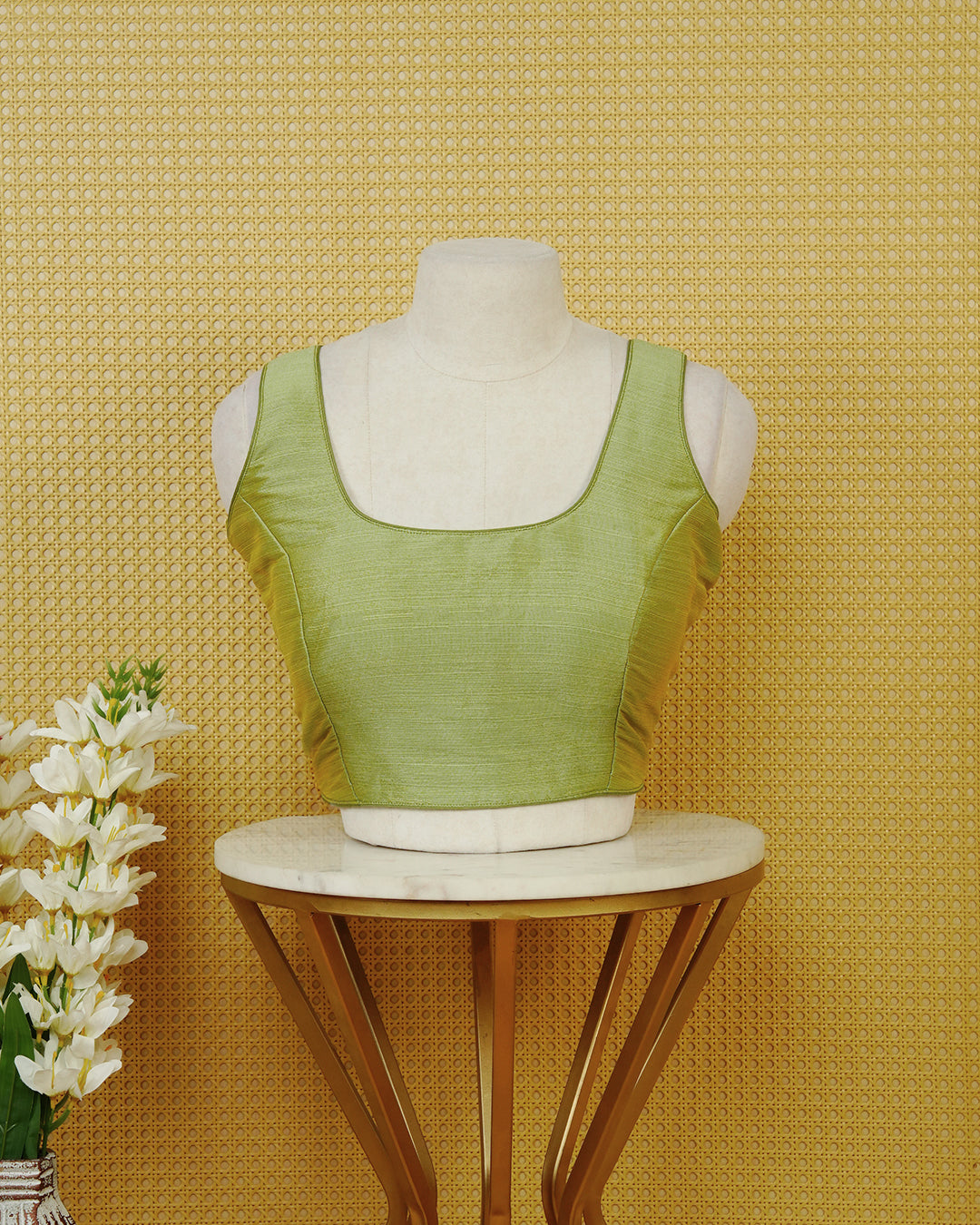 Pastel green colour Sleeveless Blouse Featuring A Classic Scoop Neck, Smooth Finish, And A Comfortable Tailored Fit.