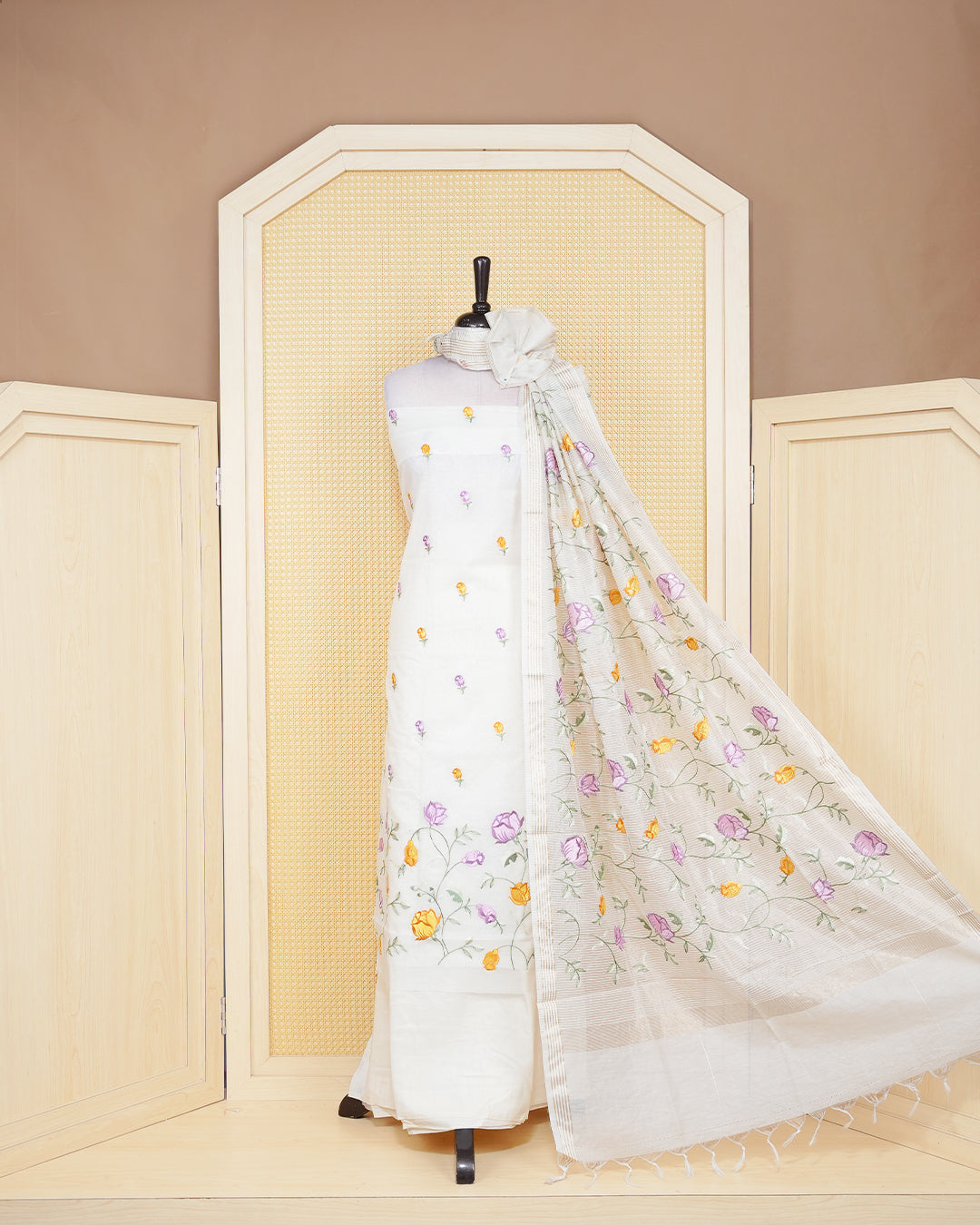 Cream colour tissue salwar material featuring beautiful floral embroidery design with elegant border, paired with matching bottom and beautiful dupatta.