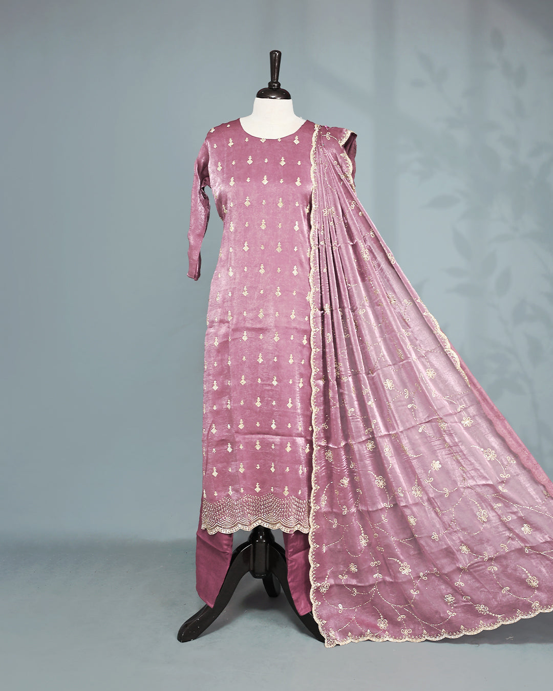 Mauve colour salwar set with Stone work on top, paired with matching bottom & Dupatta.