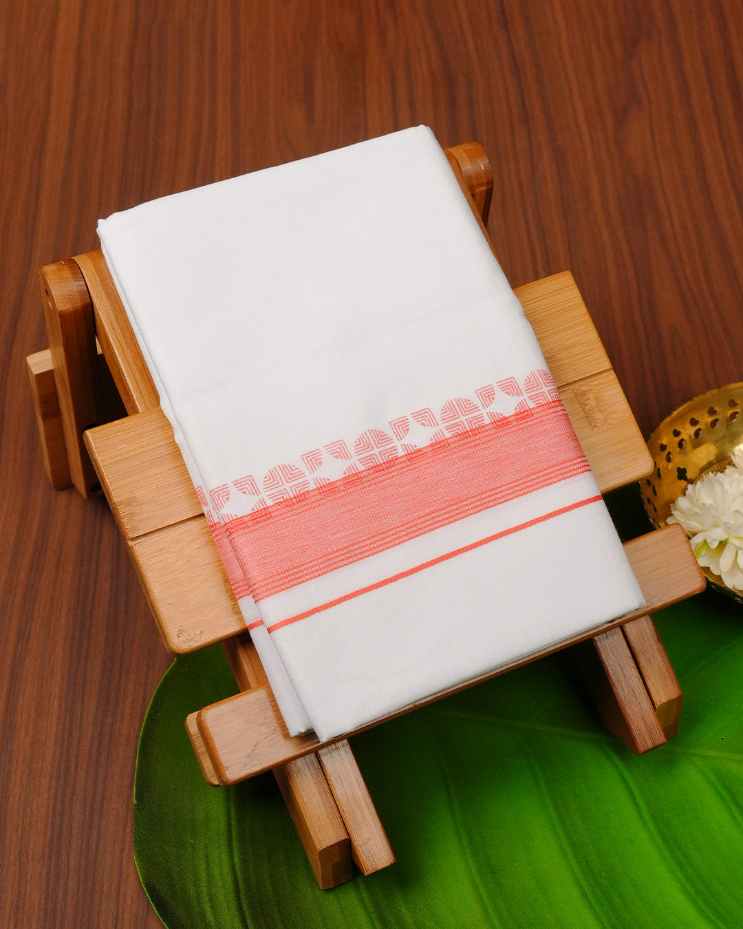 White colour cotton Double dhoti featuring Peach with geometric border.