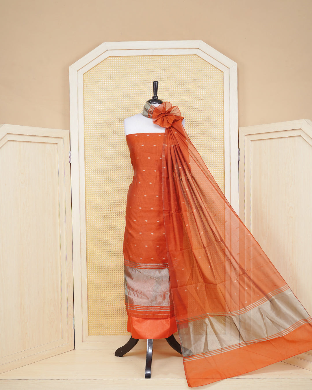 Bunt Orange Colour Mul Chanderi Salwar Material Featuring Gold Zari Buttas on body, Paired With Matching Mottom & Elegant Dupatta