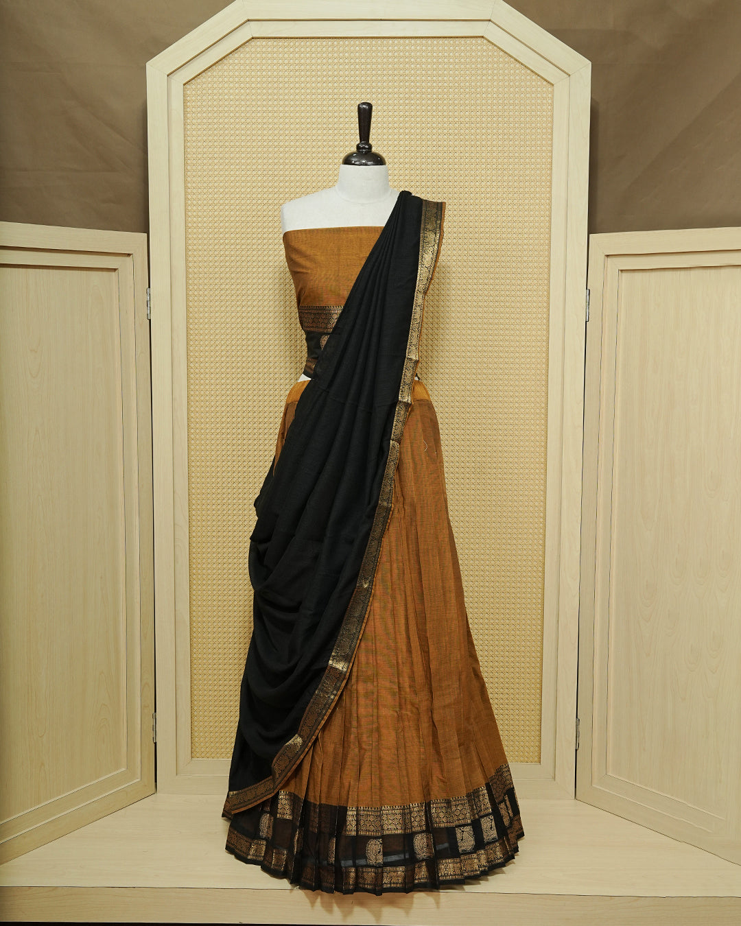 Mustard Colour chettinad cotton Semi stitched dhavani set featuring Contrast Black with Gold zari border skirt, comes with Matching blouse piece & dupatta.