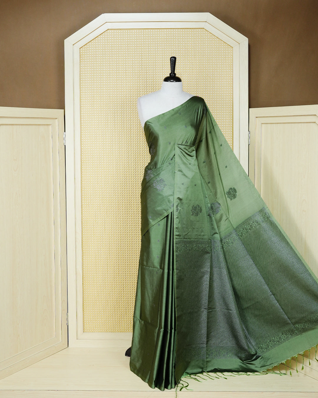 Pastel green colour soft silk saree featuring antique zari motifs on body with contrast self colour pallu & paired with matching blouse piece.