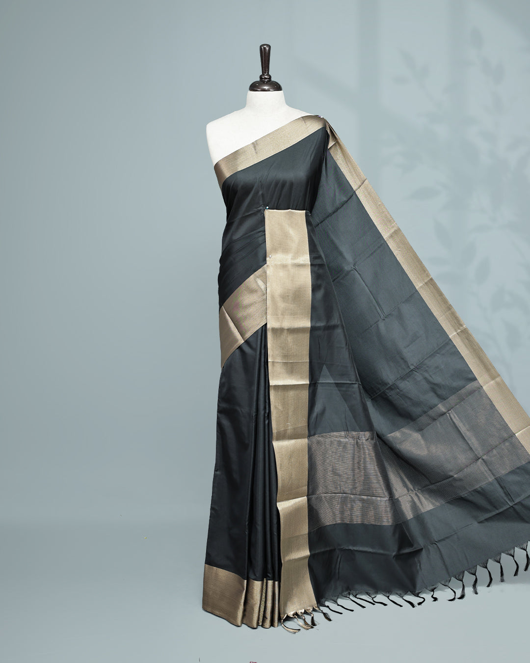 Black colour saree featuring a plain body, complemented by a Bavanchi border and contrast pallu, paired with a matching blouse piece.