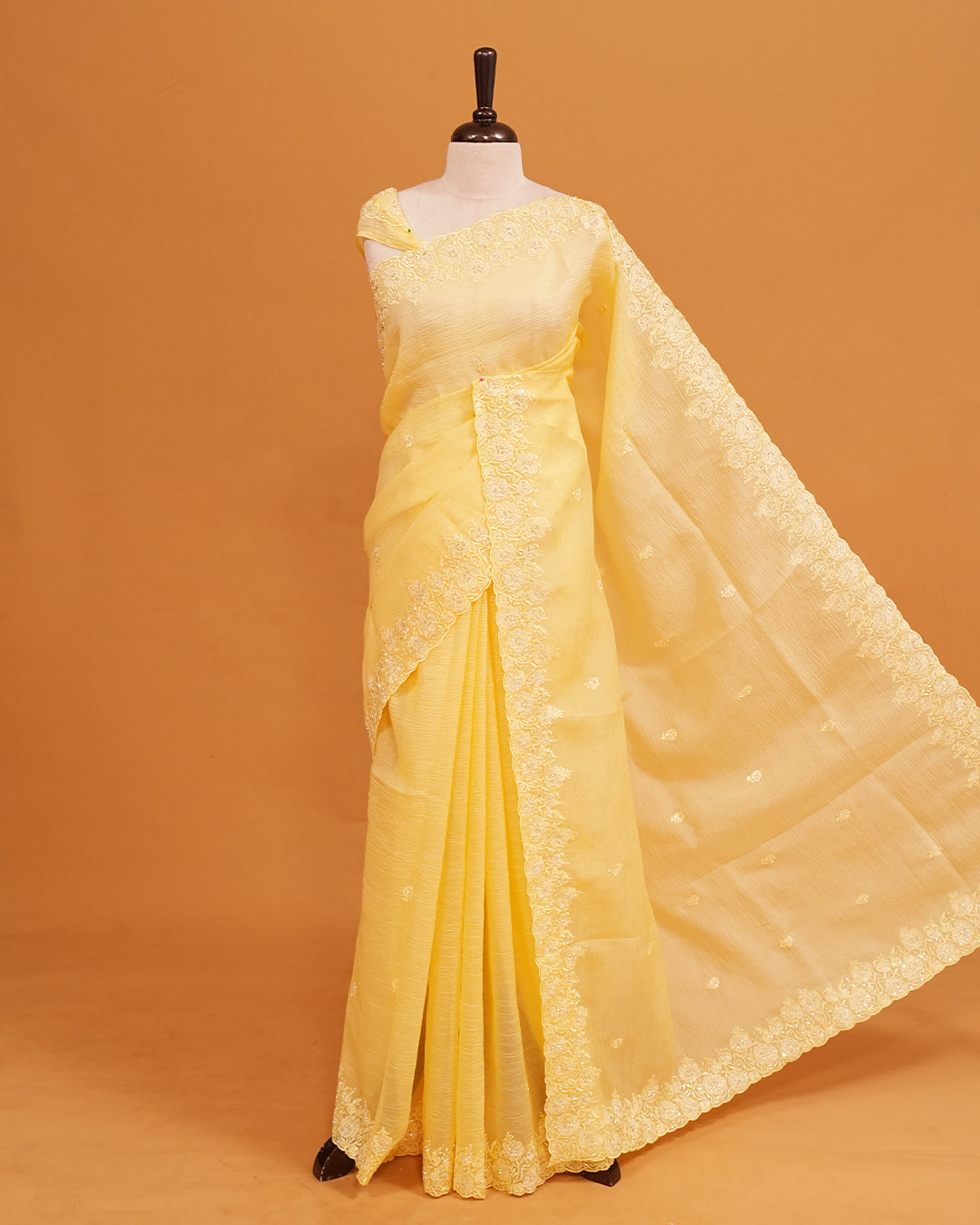 Pastel Yellow colour Crush organza saree with Cut Beats & Sequins.
