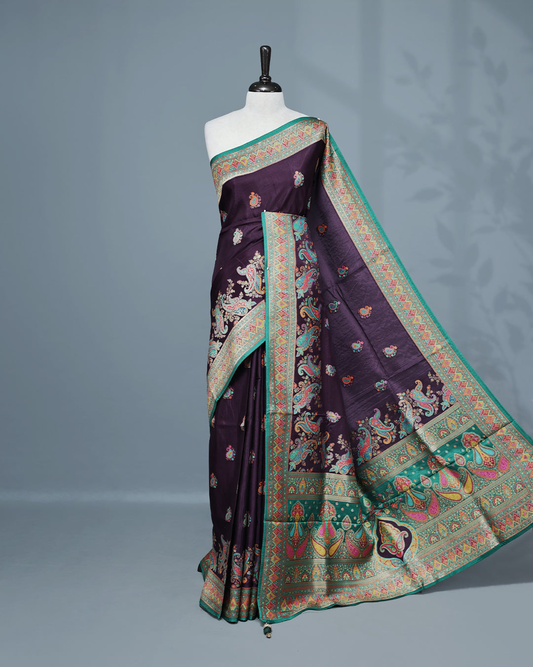 Purple Colour Pashmina Saree featuring Mango motifs on body, complemented by Contrast Green colour with Floral pattern & gold zari on border and Pallu, comes with matching blouse piece.
