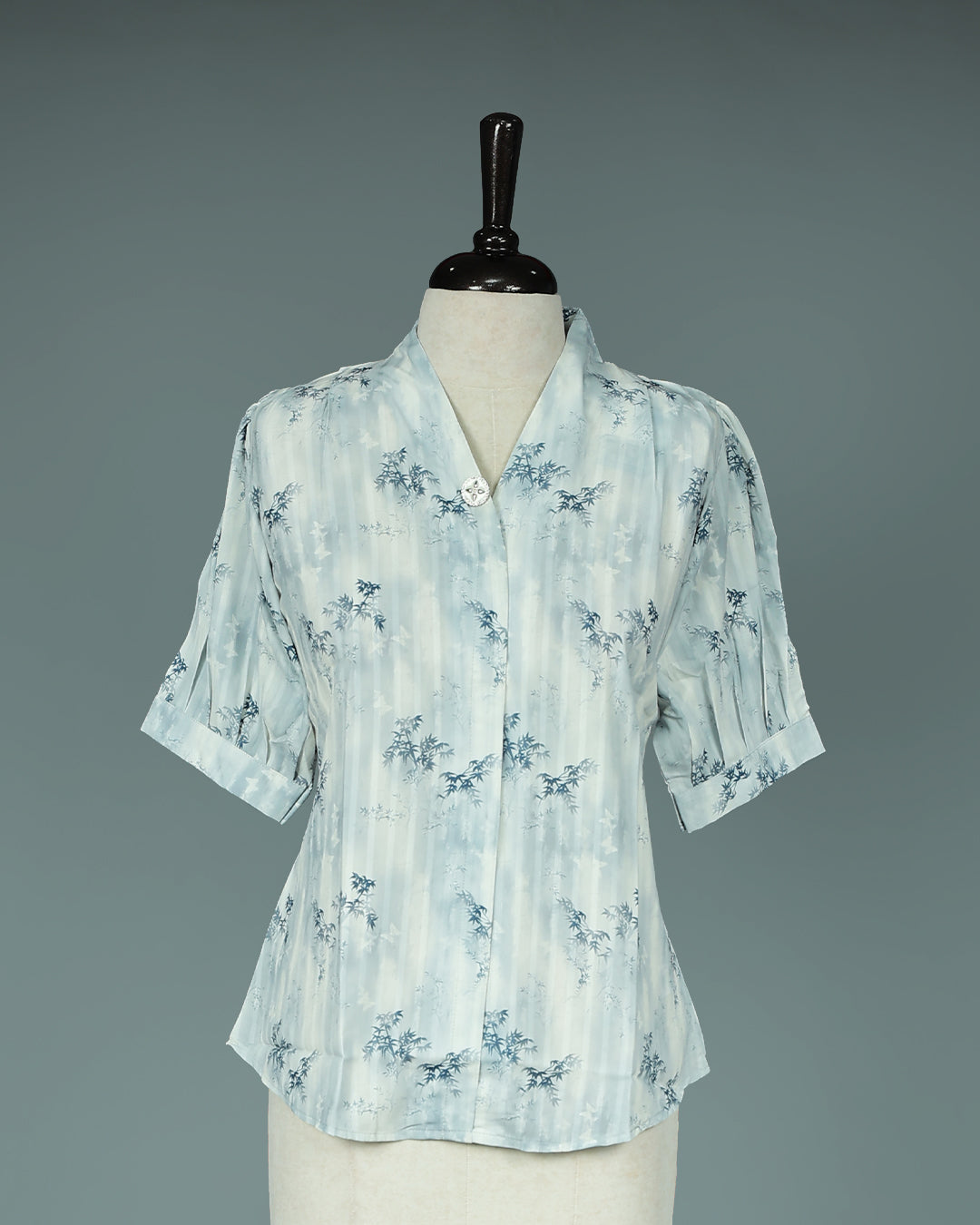 Light Blue colour Top with Leaf Print work on body, collar design, With sleeve.