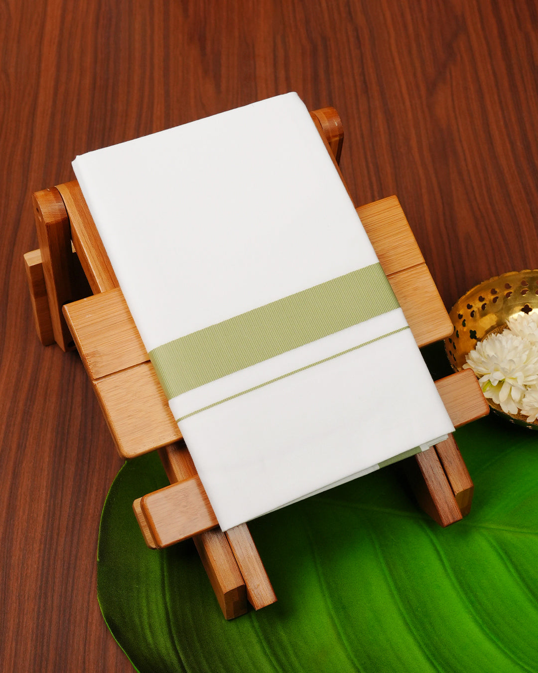 White colour cotton single dhoti featuring light green border.