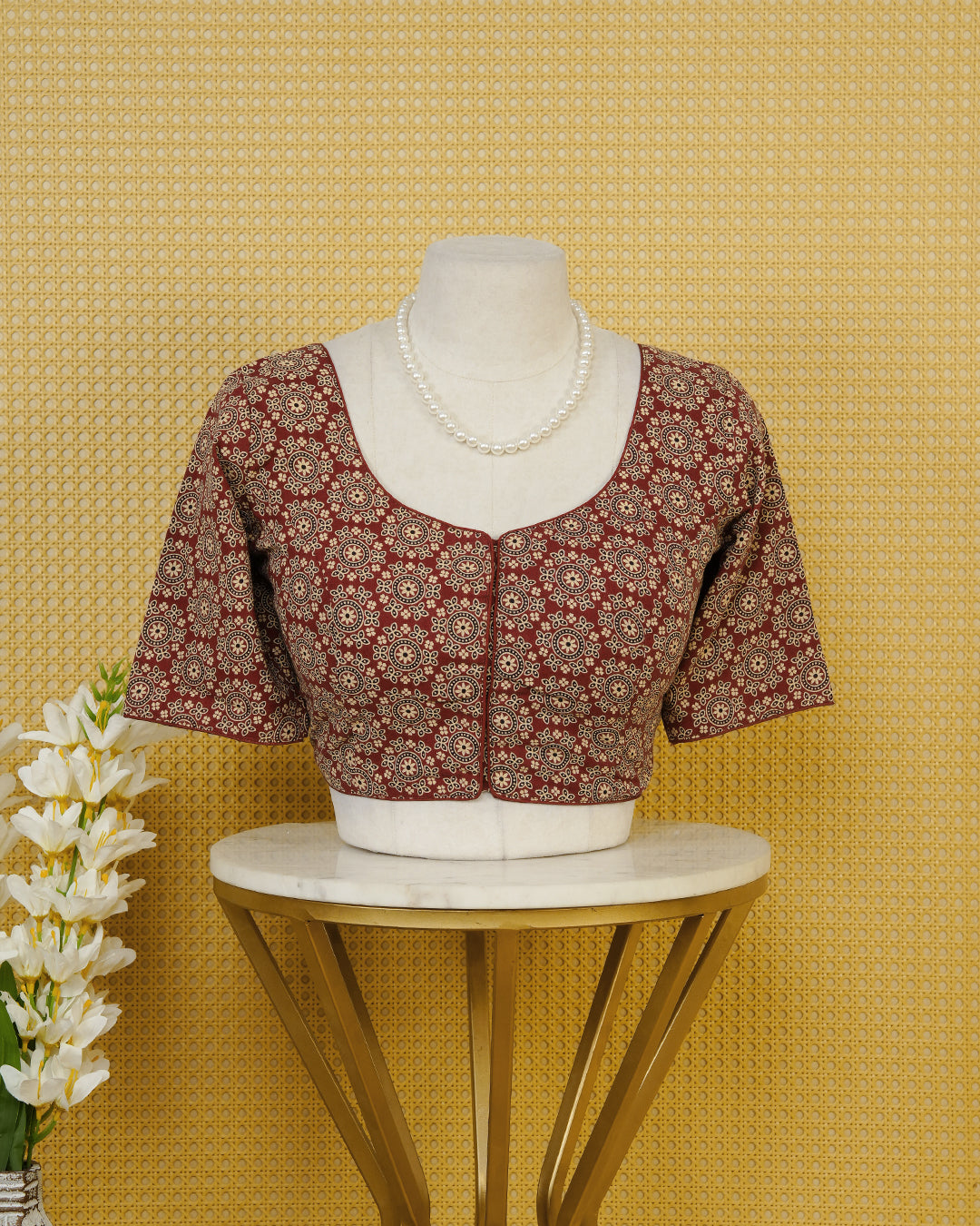 Maroon Colour Blouse Featuring A Classic U-Neck, Intricate Floral Geometric Print, And Comfortable Elbow Length Sleeves.