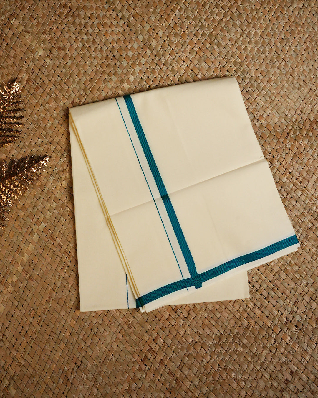 Cream colour cotton Single dhoti featuring Teal simple border.