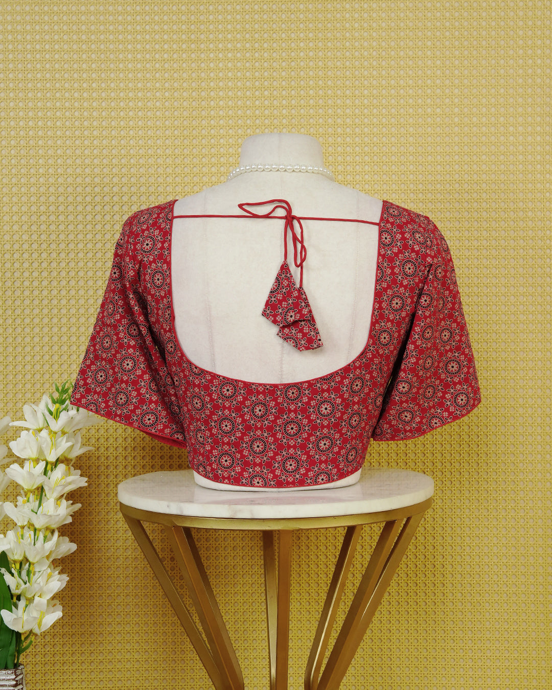 Brick Red Colour Blouse Featuring A Classic U-Neck, Intricate Floral Geometric Print, And Comfortable Elbow Length Sleeves.