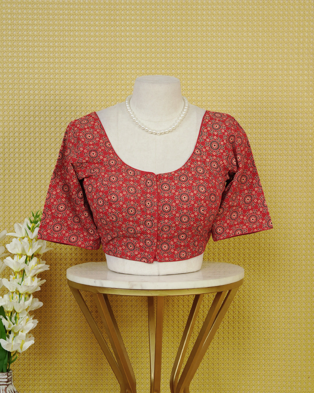 Red Colour Blouse Featuring A Classic U-Neck, Intricate Floral Geometric Print, And Comfortable Elbow Length Sleeves.