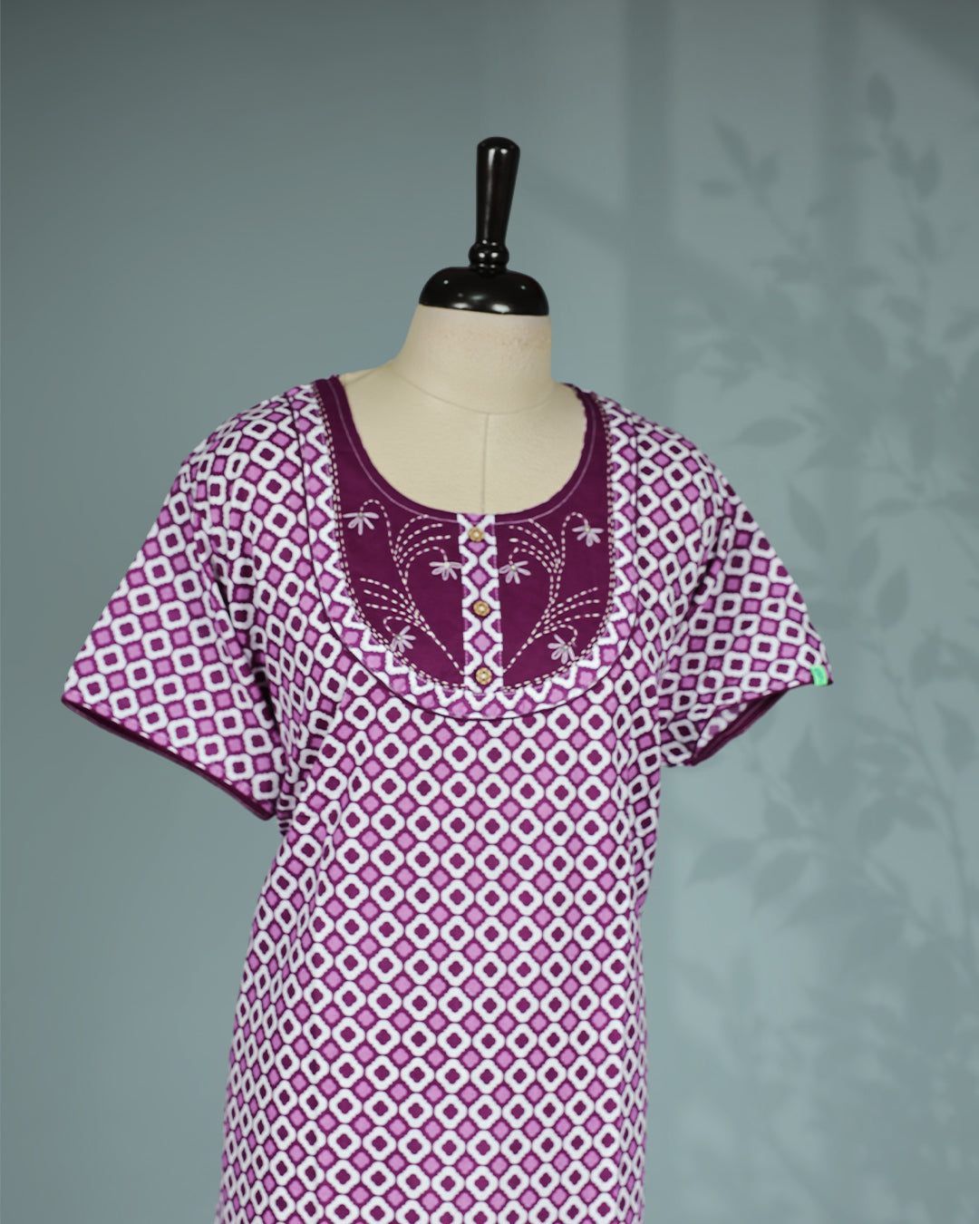 Purple and white geometric printed nighty with a classic scoop neckline, short sleeves, an embroidered contrast yoke with button detailing, and a relaxed full-length for everyday comfort and timeless style.