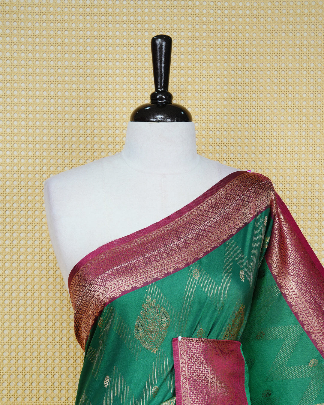 Green colour Mulberry silk saree featuring gold floral zari patterns on body, paired with contrast maroon colour with traditional border, comes with matching blouse piece.