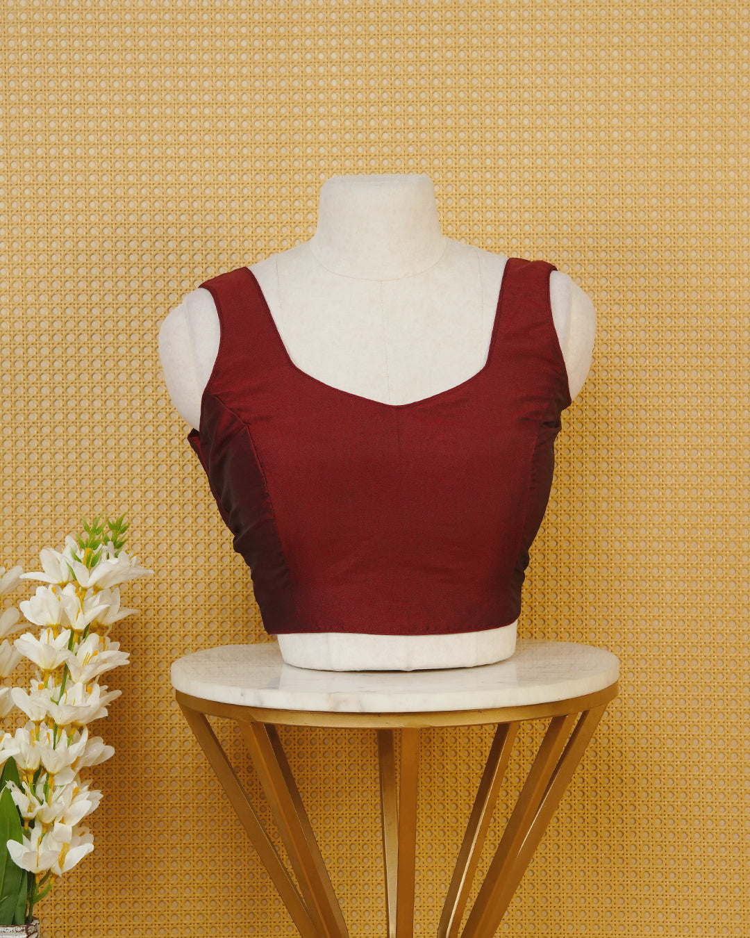 Maroon colour Sleeveless Blouse Featuring A Stylish Sweetheart Neck, Smooth Finish, And A Comfortable Tailored Fit.
