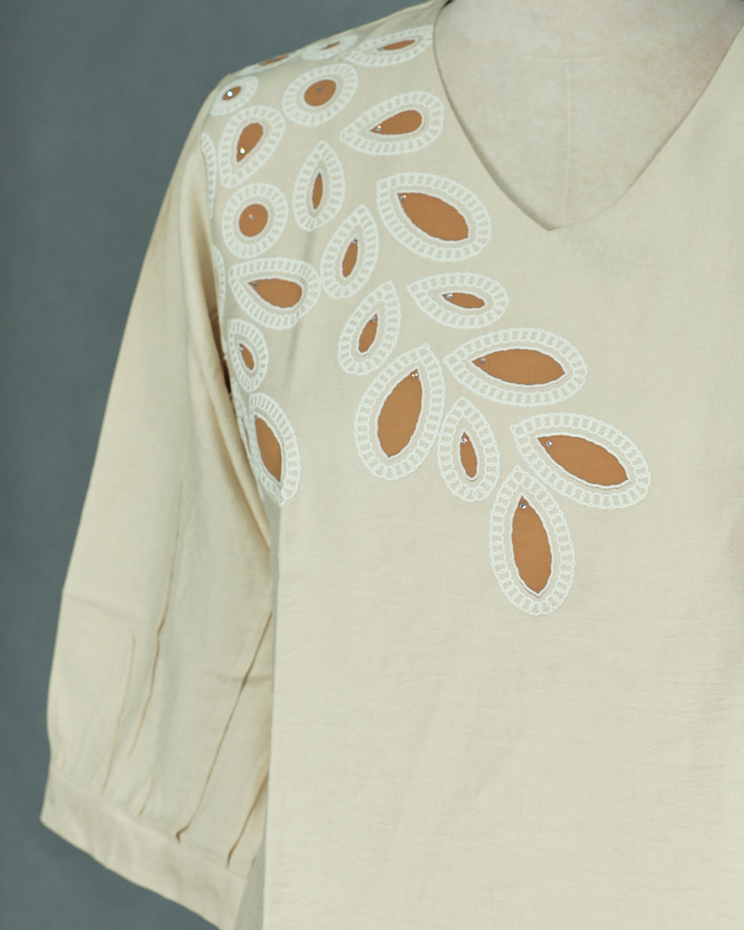 Cream colour Top with Thread work on body, V Neck design, With sleeve.