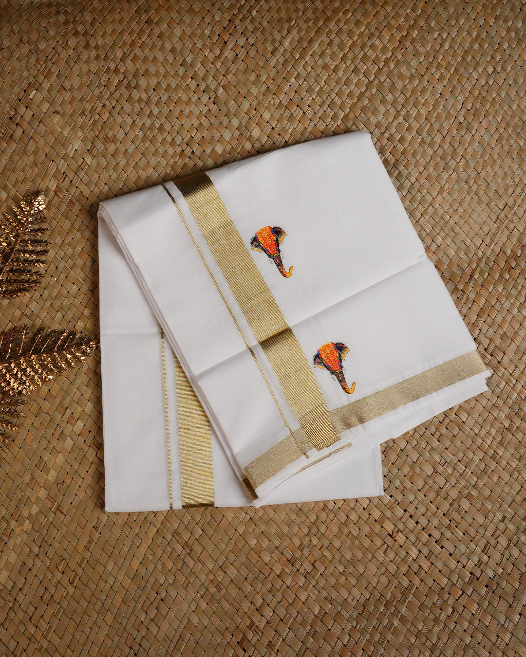 White colour cotton single dhoti featuring light gold Kasav with Elephant print border.