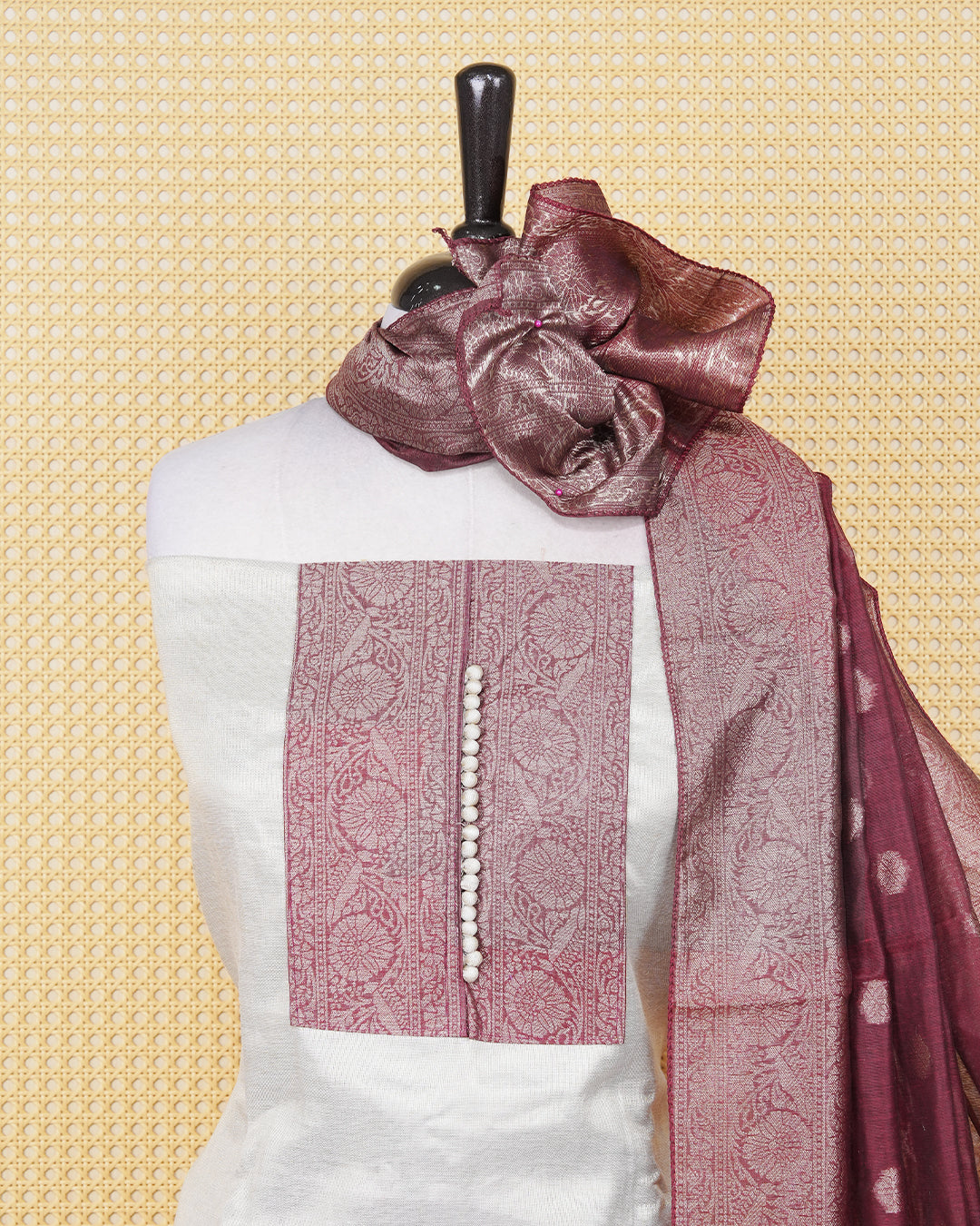 Cream colour tissue salwar material featuring plain body ,maroon colour with floral work on chest portion, Paired With a Matching Bottom and an Elegant Dupatta.