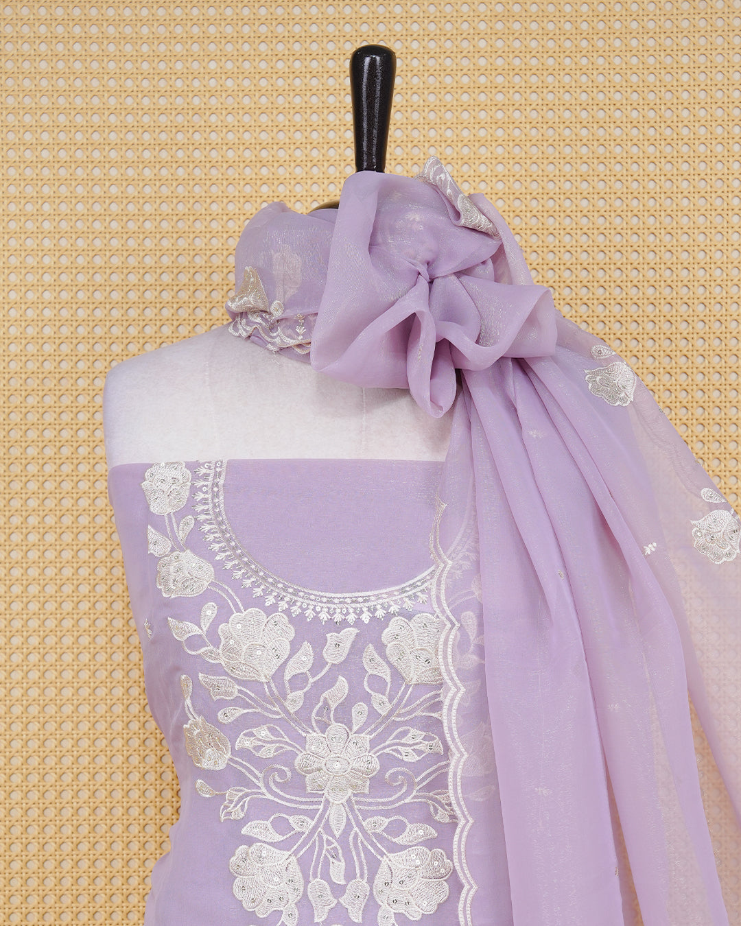 Lavender Pink Georgette Salwar Material featuring an intricate floral embroidery pattern adorned with shimmering sequin accents, paired with a matching bottom and an elegant dupatta.