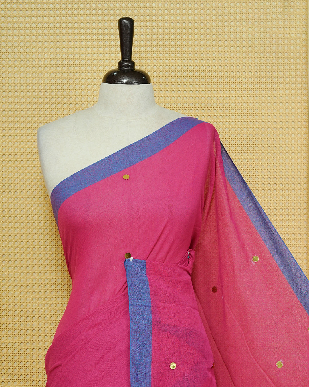 Magenta colour Mul cotton saree featuring Gold Sequins, complemented by Contrast Blue simple Border & tassels.