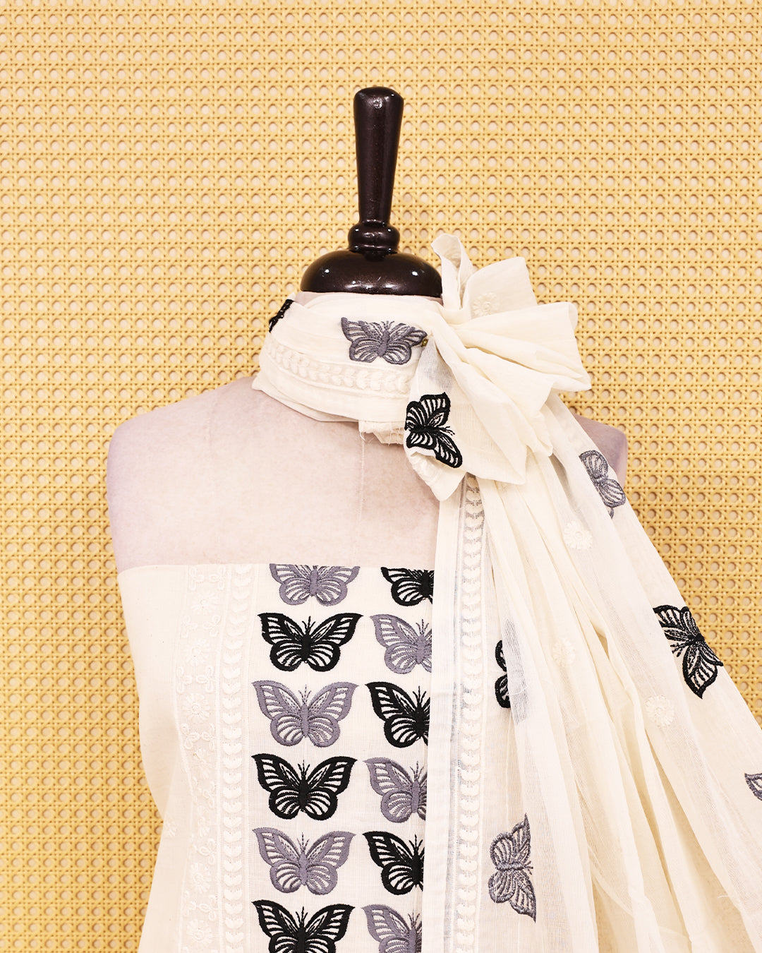 Off White colour Cotton salwar material featuring Thread Butterfly work on body, paired with matching bottom & dupatta.