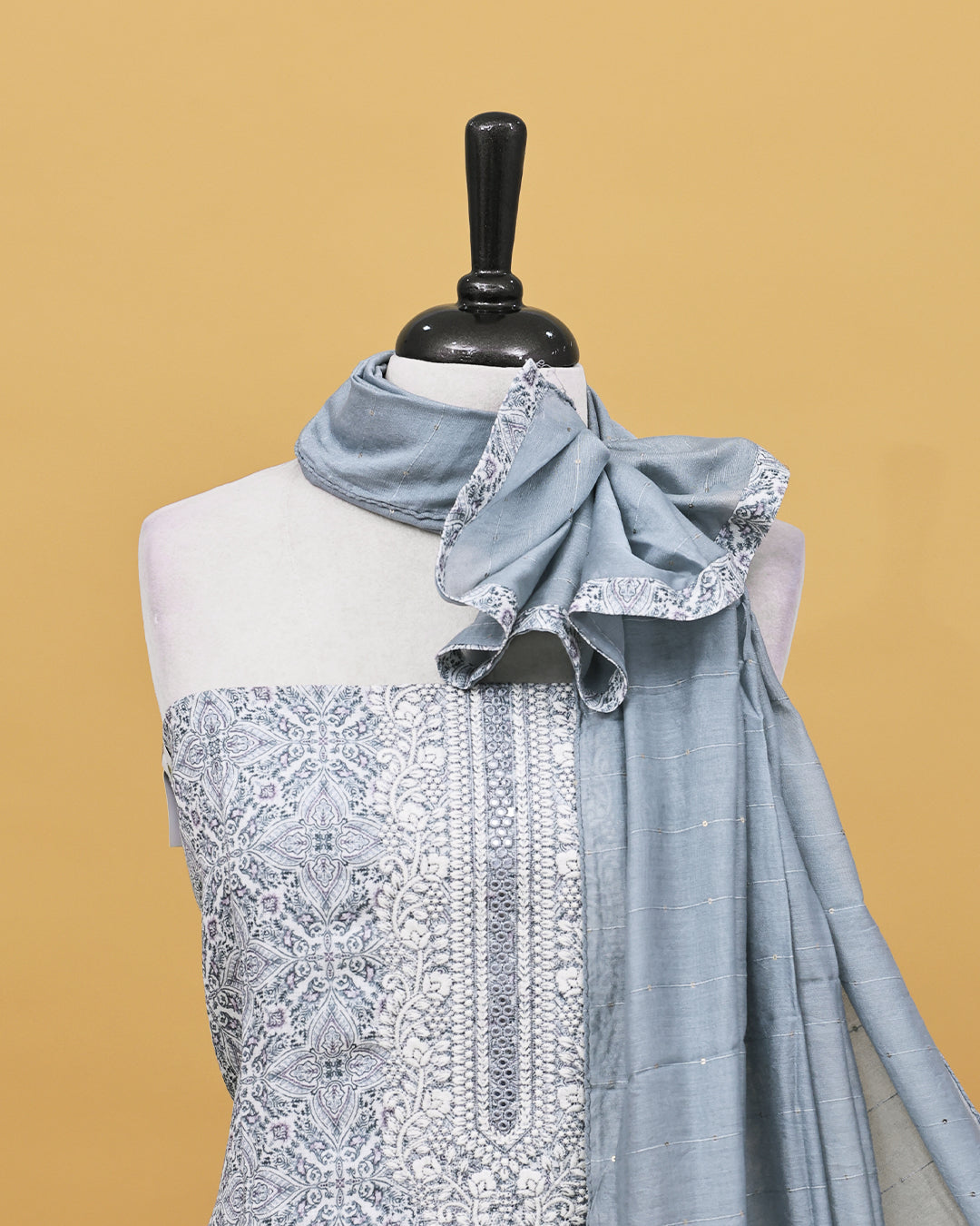 Cream colour Net cotton Salwar material with Grey colour floral kodi pattern work on body, matching bottom & Dupatta.