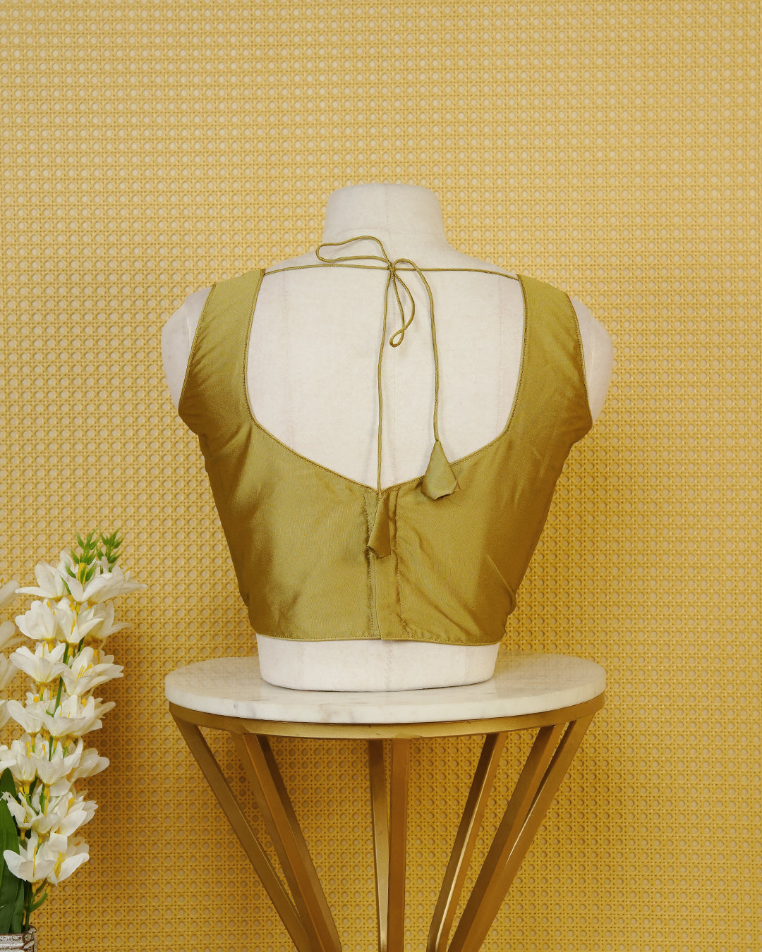 Olive colour Sleeveless Blouse Featuring A Stylish Sweetheart Neck, Smooth Finish, And A Comfortable Tailored Fit.