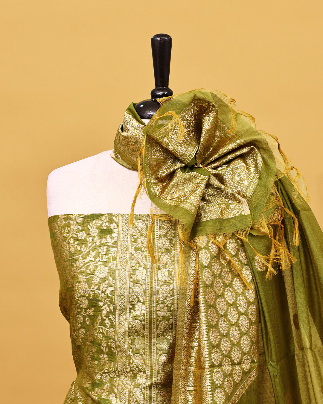 Olive colour Banaras Salwar material with gold zari floral kodi pattern work on body, matching bottom & Dupatta.