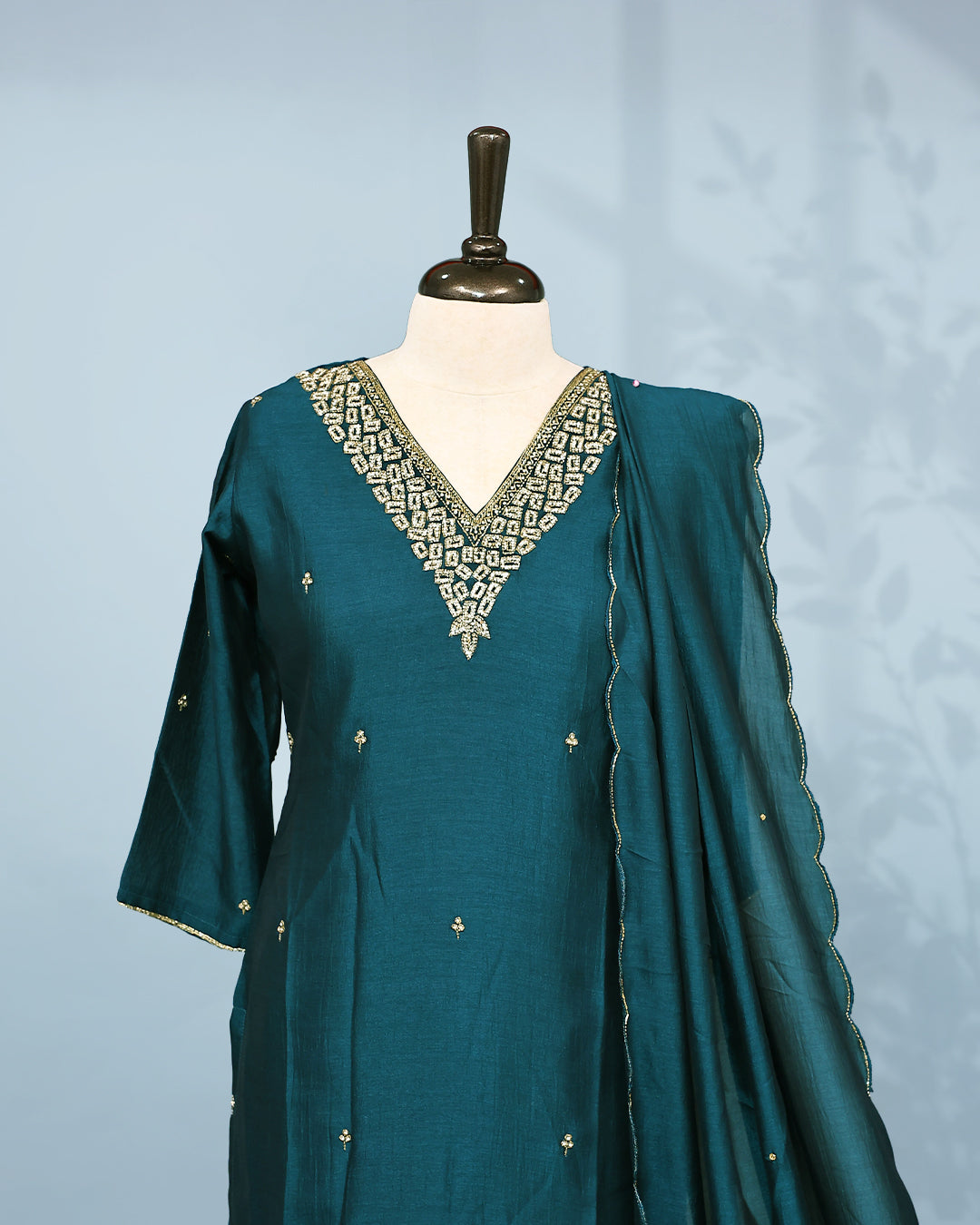 Green colour Salwar set comes top with Stone & beats on neck line and buttas in body, paired with matching bottom and dupatta.