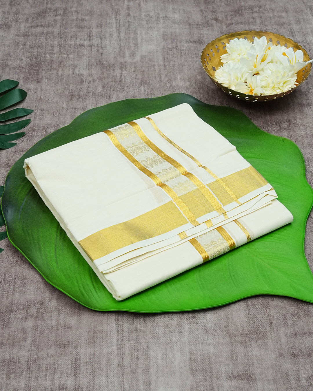 Cream Coloured Cotton Double Dhoti Finished With Gold Zari Lotus Prints & Gold Kara